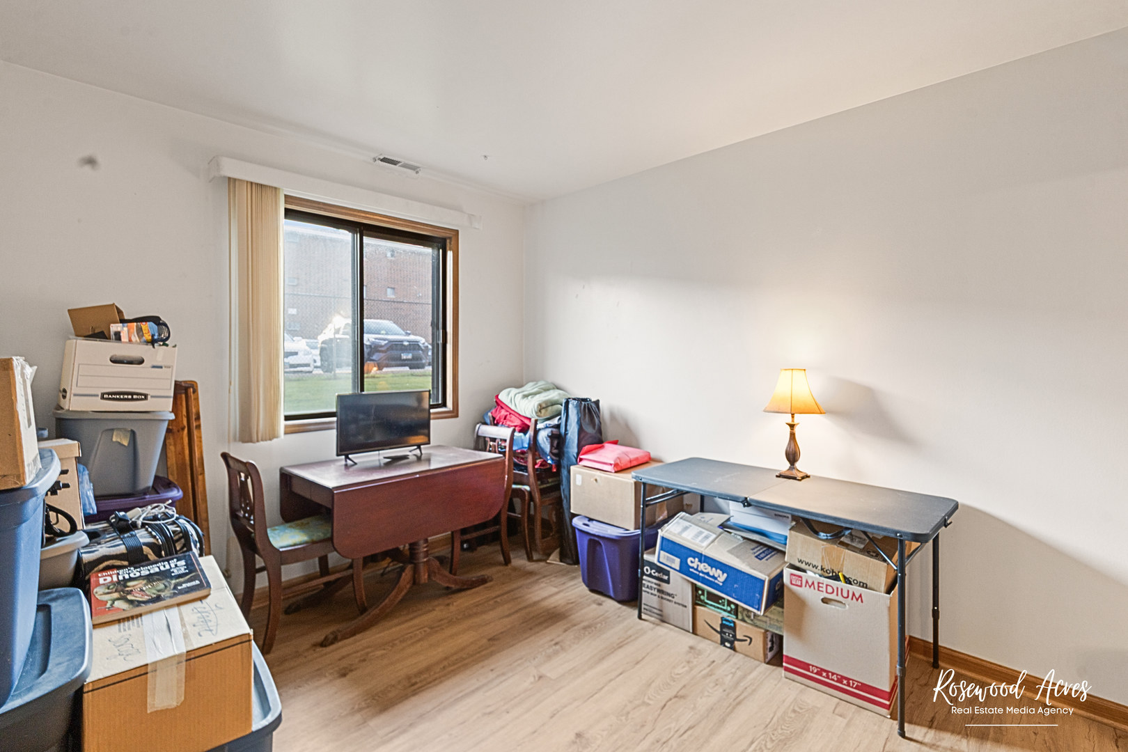 15718 Peggy Lane, Unit 2 Oak Forest, IL 60452 - Photo 13 of 16 a bedroom with furniture and a window