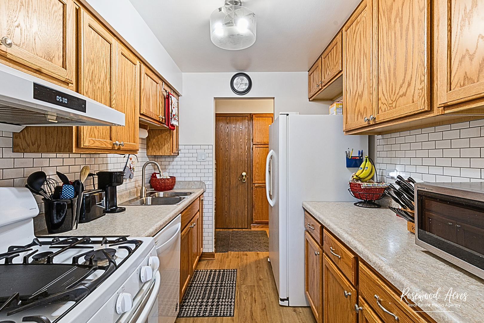 15718 Peggy Lane, Unit 2 Oak Forest, IL 60452 - Photo 3 of 16 a kitchen with stainless steel appliances a stove a sink and cabinets