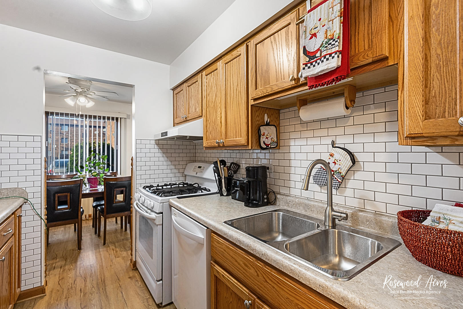 15718 Peggy Lane, Unit 2 Oak Forest, IL 60452 - Photo 4 of 16 a kitchen with stainless steel appliances granite countertop a sink and cabinets