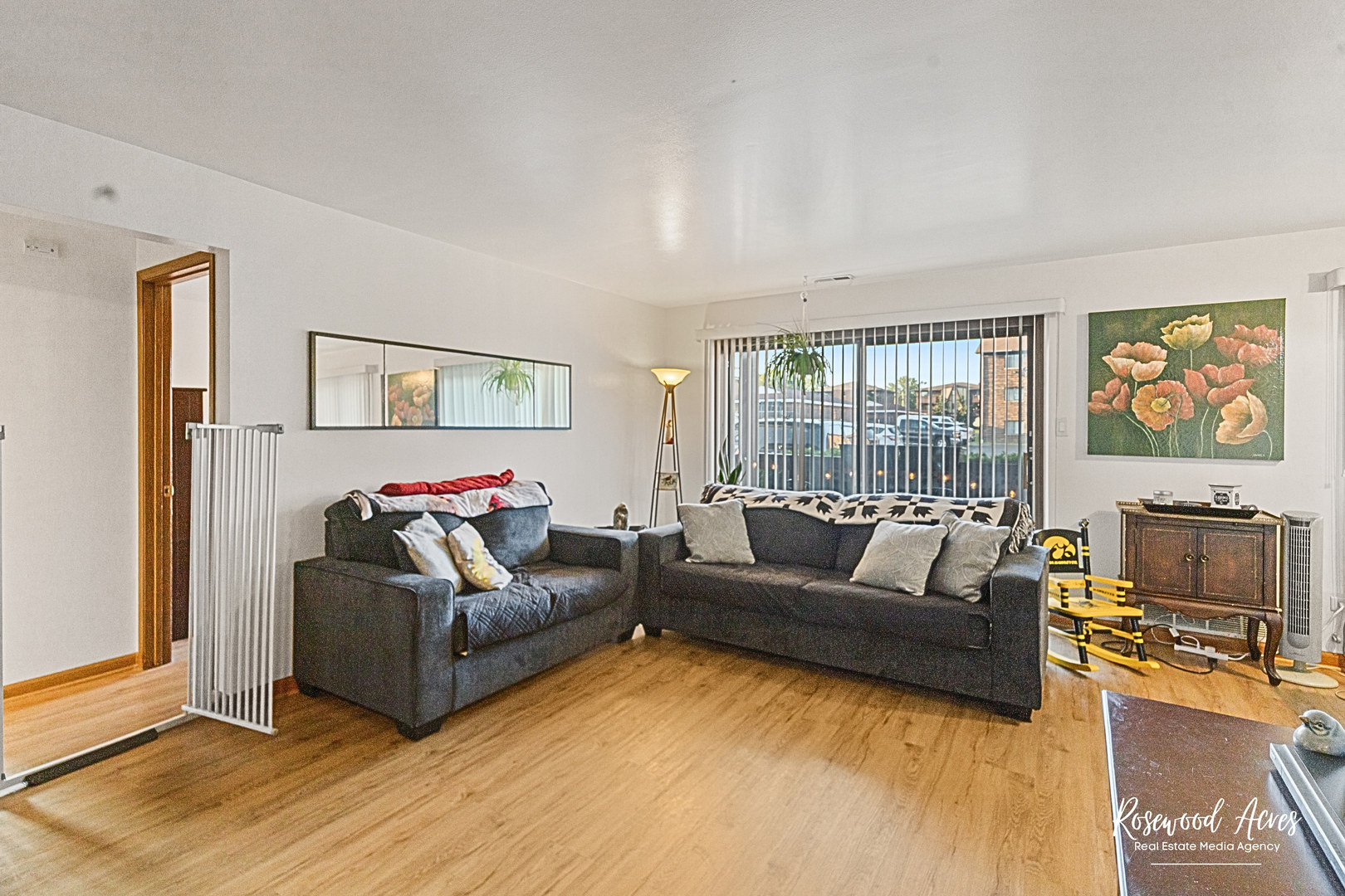 15718 Peggy Lane, Unit 2 Oak Forest, IL 60452 - Photo 8 of 16 a living room with furniture and a flat screen tv
