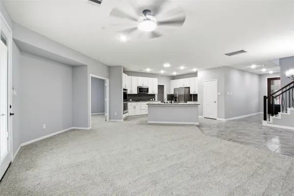 a view of a kitchen with a sink and a window