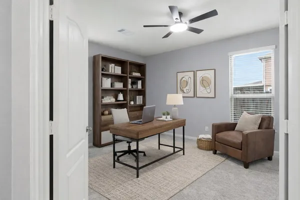 a workspace with furniture and window
