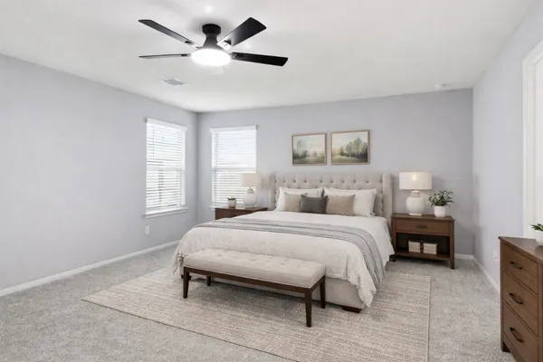 a bedroom with a bed and window