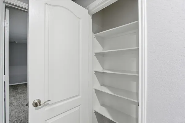 a view of an empty walk in closet