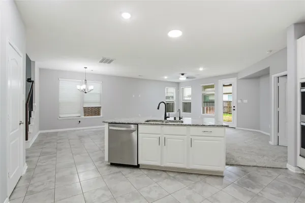 a kitchen with a sink and cabinets