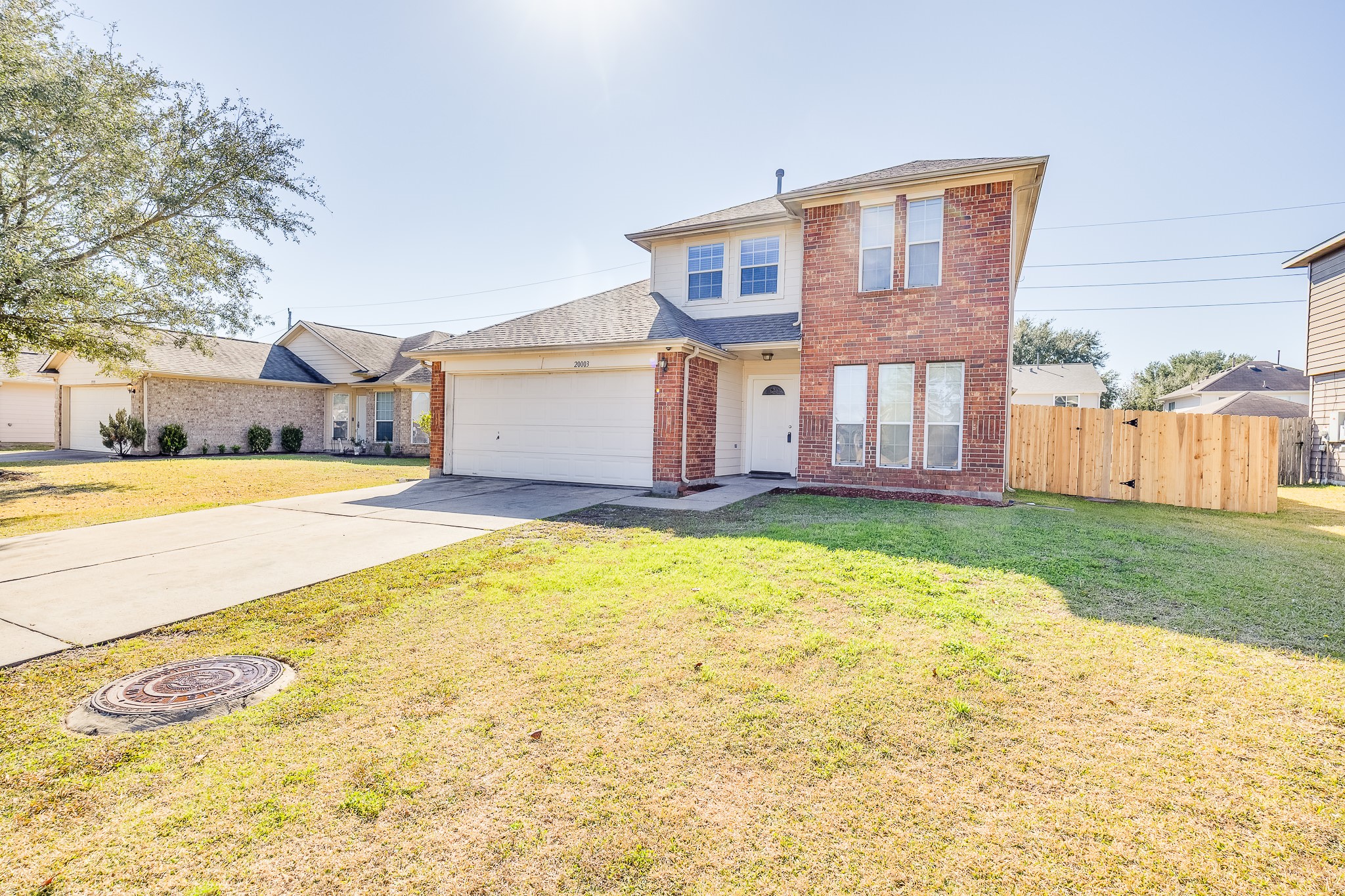 20003 Rustic Lake Lane Cypress, TX 77433 - Photo 1 of 21 a view of an house with backyard and tree s