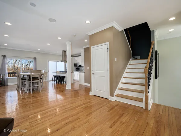 a view of kitchen with furniture and wooden floor
