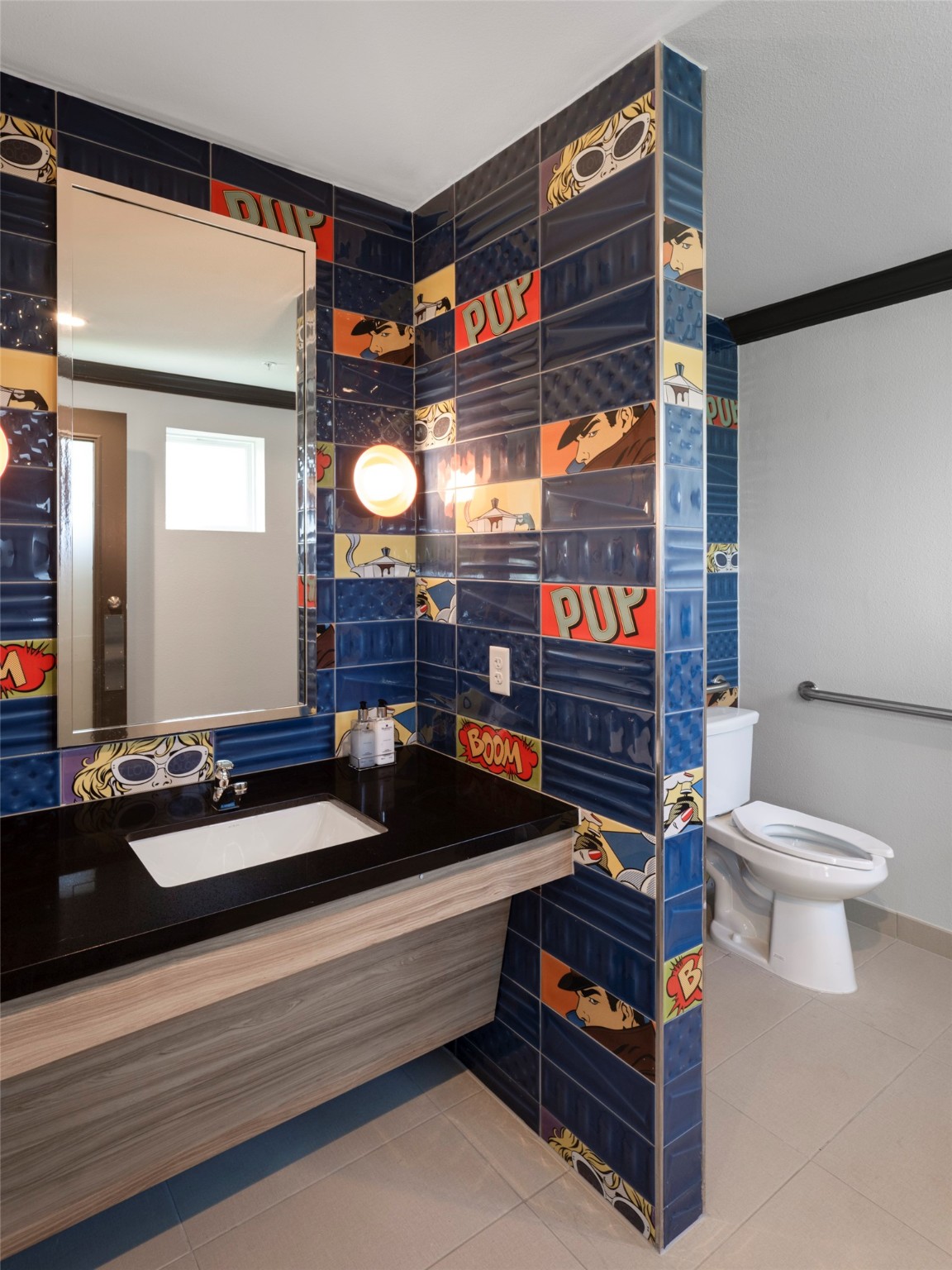 1800 South Interstate 35 Frontage Road Austin, TX 78704 - Photo 17 of 36 a bathroom with a sink and a mirror