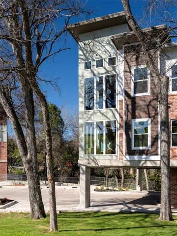 a view of a building with a yard