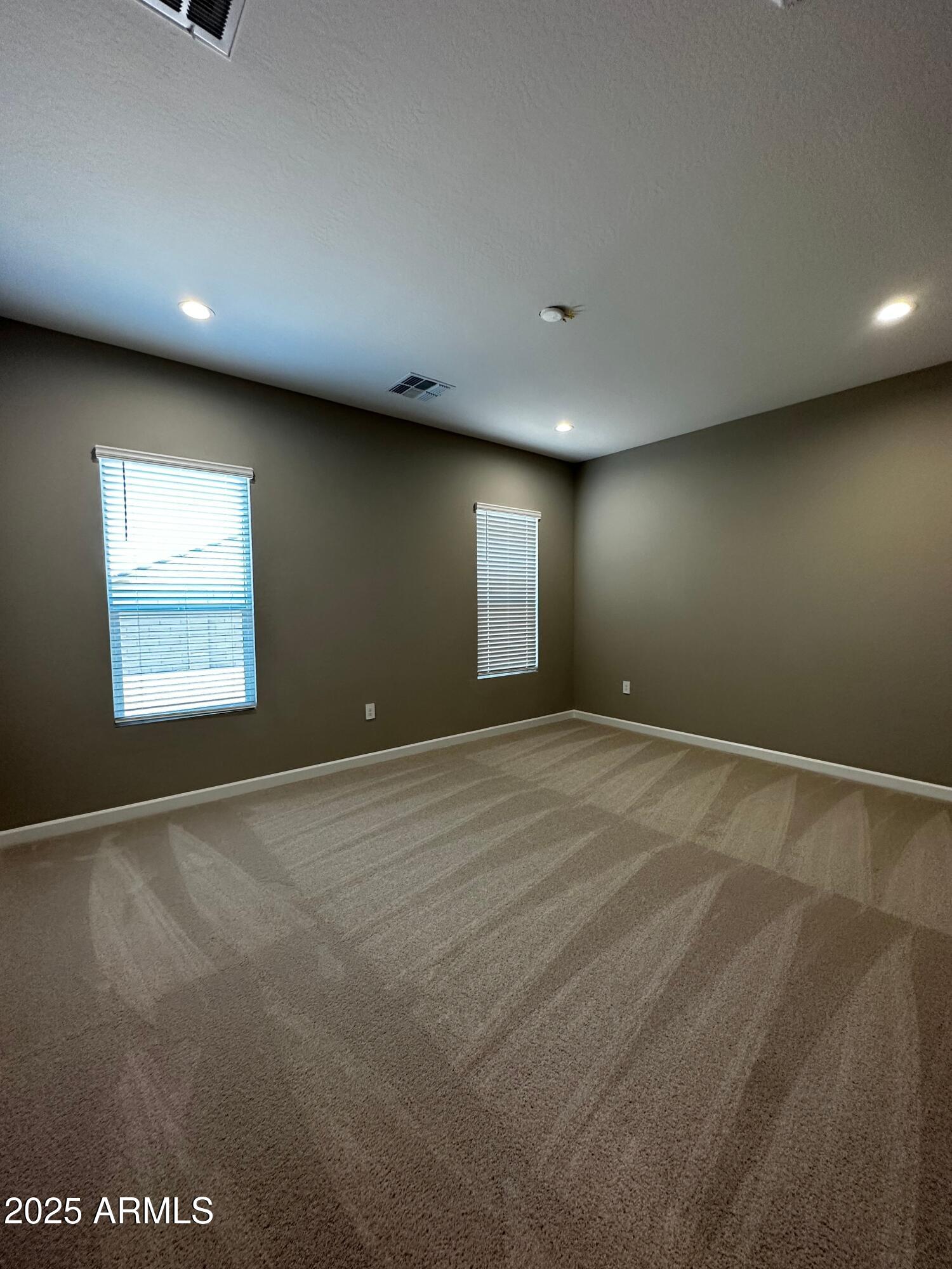 21560 North 102nd Avenue Peoria, AZ 85382 - Photo 7 of 15 an empty room with windows