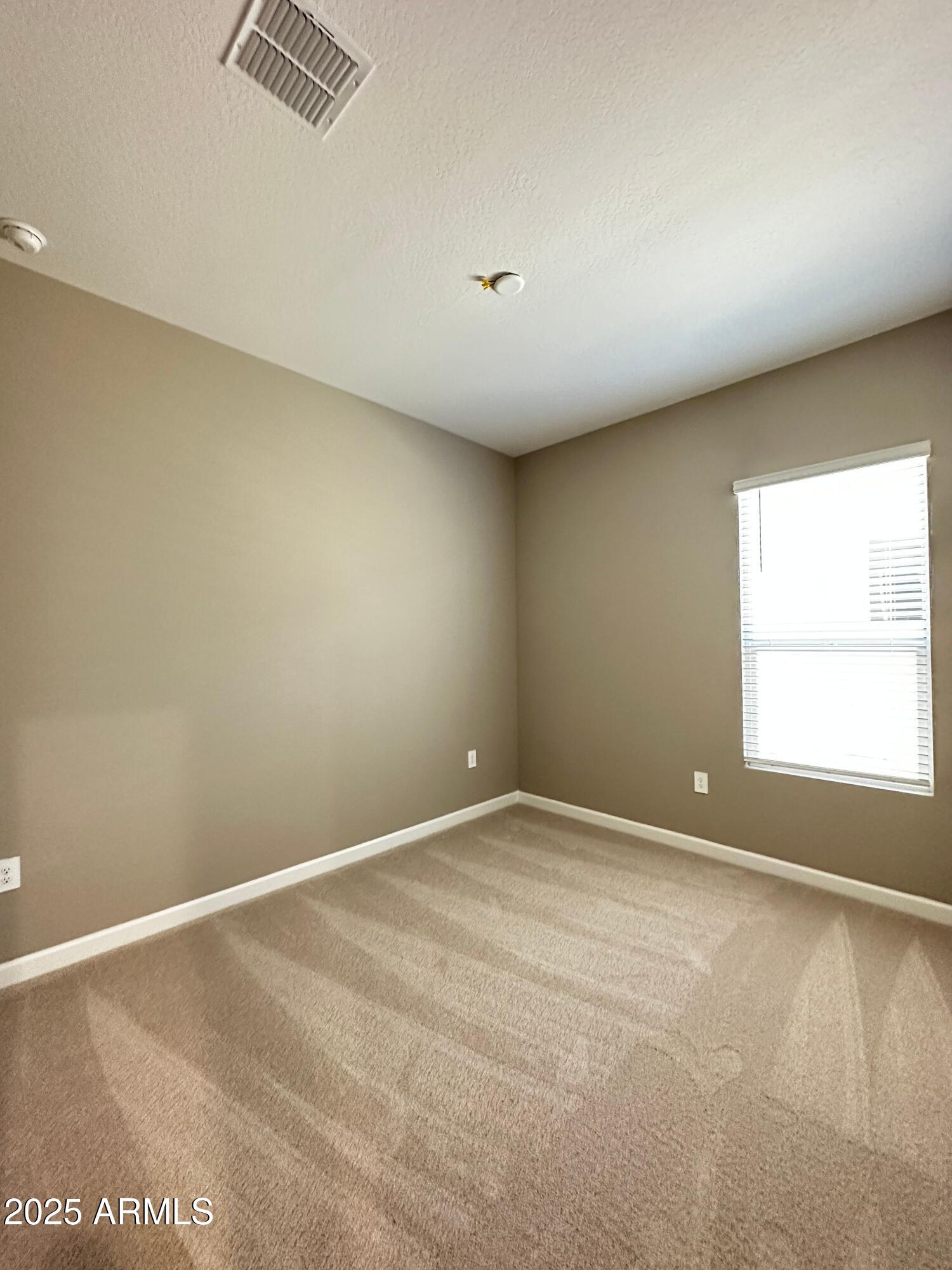 21560 North 102nd Avenue Peoria, AZ 85382 - Photo 9 of 15 an empty room with a window