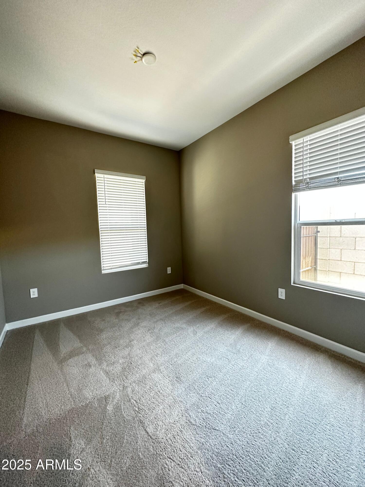 21560 North 102nd Avenue Peoria, AZ 85382 - Photo 10 of 15 an empty room with a window