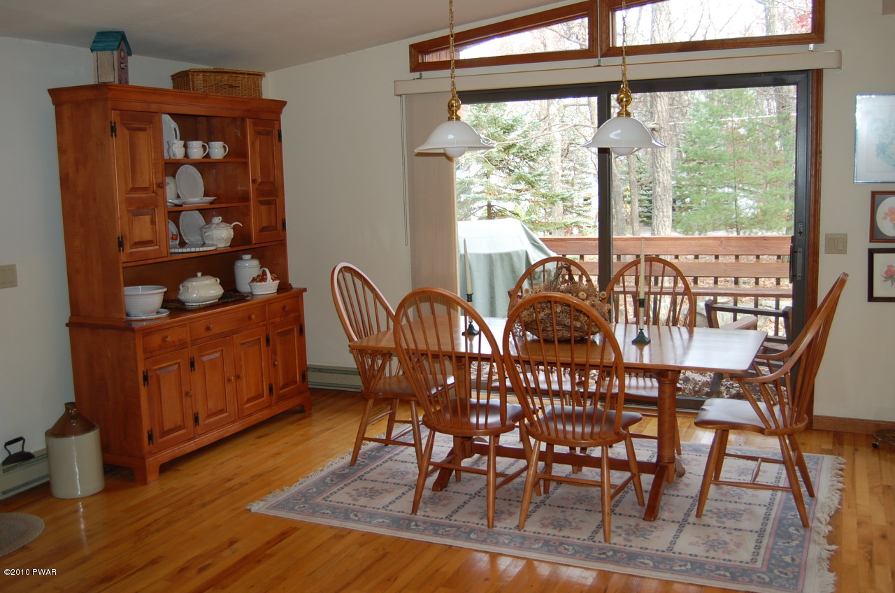 140 Rodeo Drive Hawley, PA 18428 - Photo 3 of 9 a view of a dining room with furniture window and wooden floor