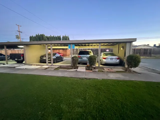 a view of a house with backyard porch and sitting area