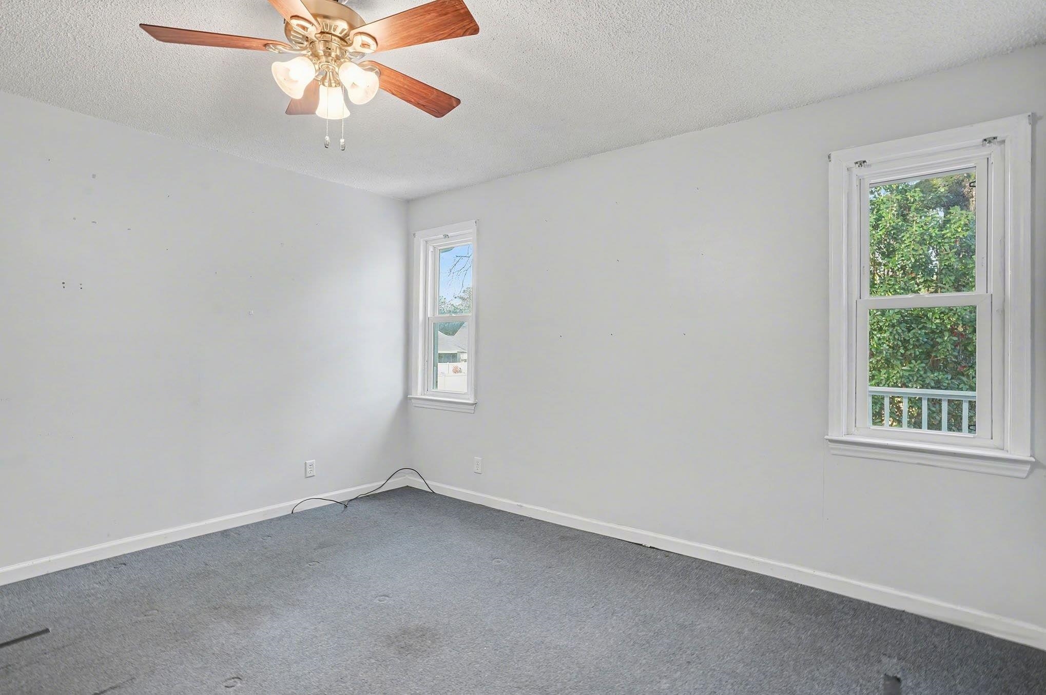 152 Brookgate Drive Myrtle Beach, SC 29579 - Photo 19 of 35 Spare room featuring a textured ceiling, carpet, and ceiling fan