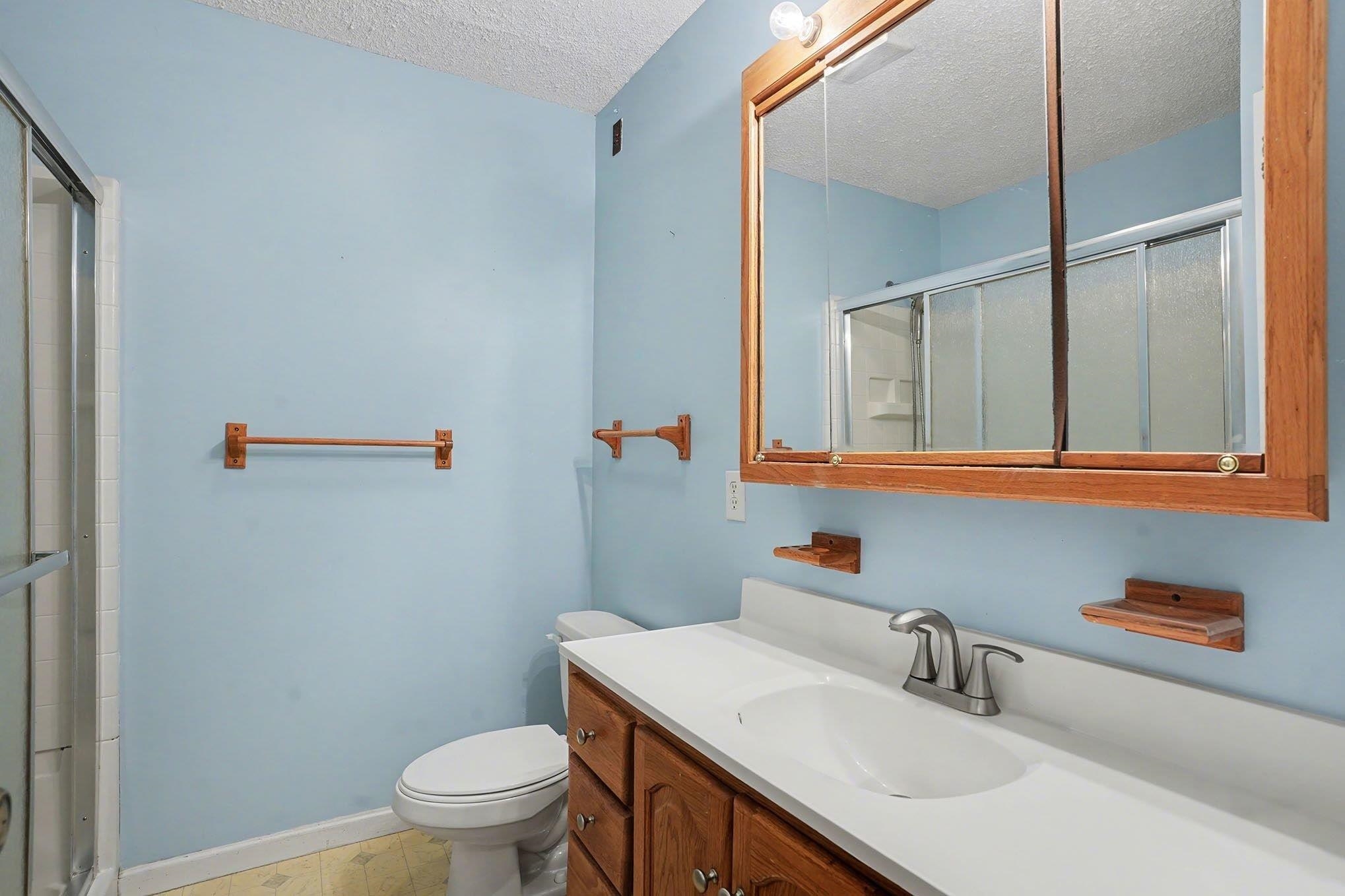 152 Brookgate Drive Myrtle Beach, SC 29579 - Photo 22 of 35 Full bath with a textured ceiling, a stall shower, and vanity