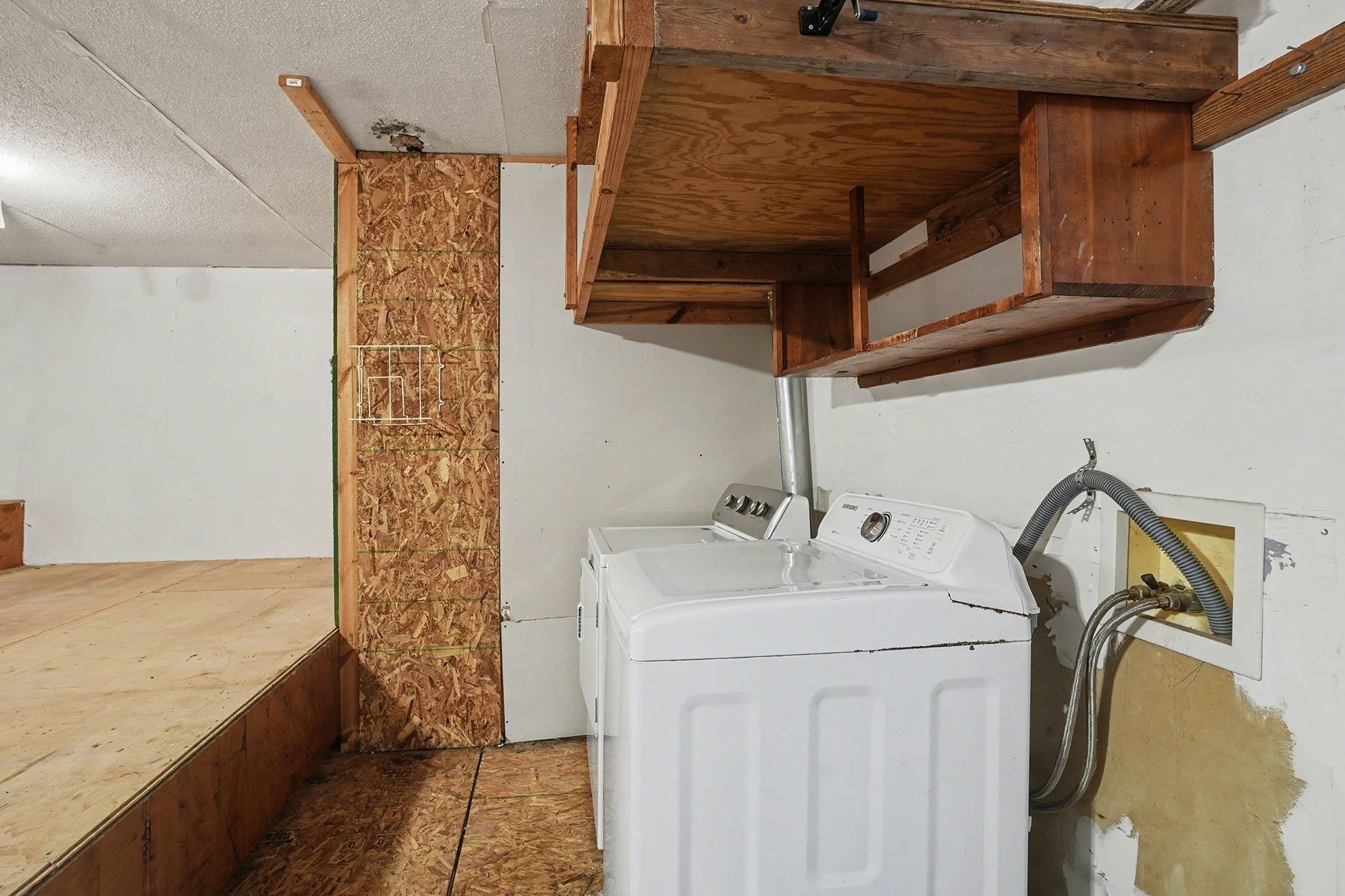 152 Brookgate Drive Myrtle Beach, SC 29579 - Photo 26 of 35 Washroom featuring washer and dryer and a textured ceiling