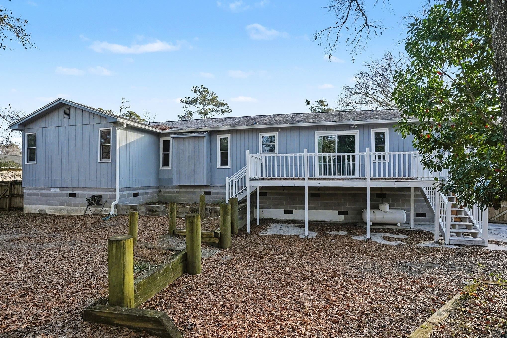 152 Brookgate Drive Myrtle Beach, SC 29579 - Photo 33 of 35 Back of property with crawl space, stairs, a shingled roof, and a deck