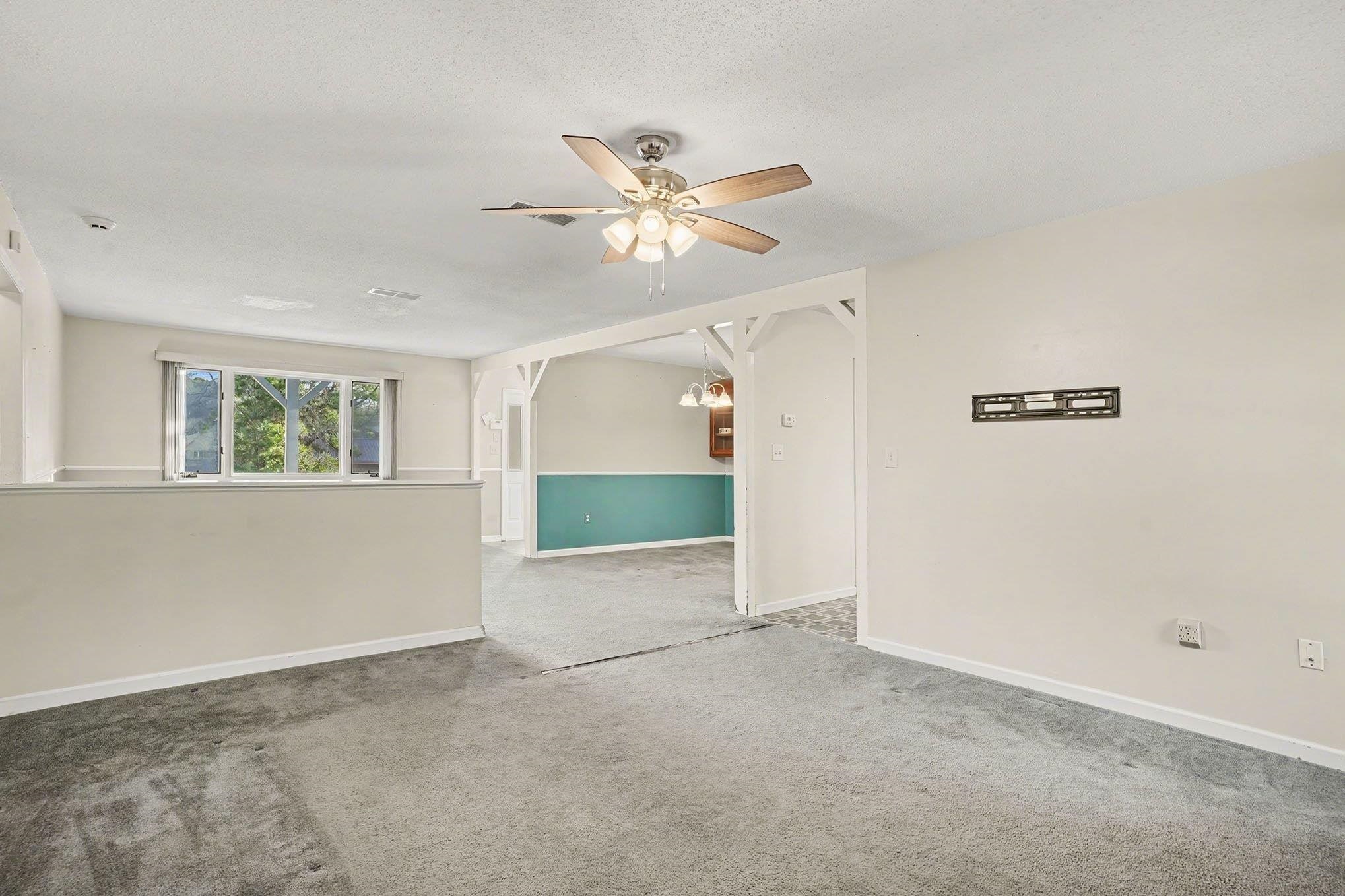 152 Brookgate Drive Myrtle Beach, SC 29579 - Photo 6 of 35 Carpeted spare room with ceiling fan and a textured ceiling