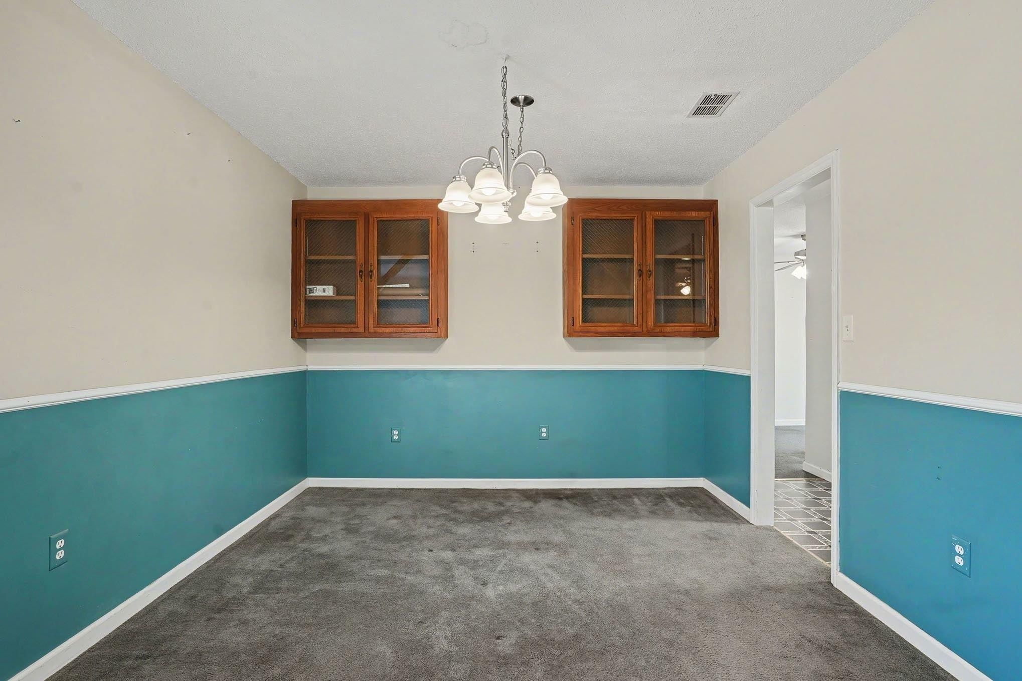 152 Brookgate Drive Myrtle Beach, SC 29579 - Photo 8 of 35 Unfurnished dining area featuring a chandelier and dark carpet