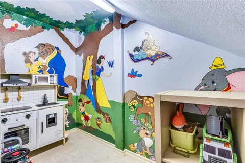 kids room with toys and dresser