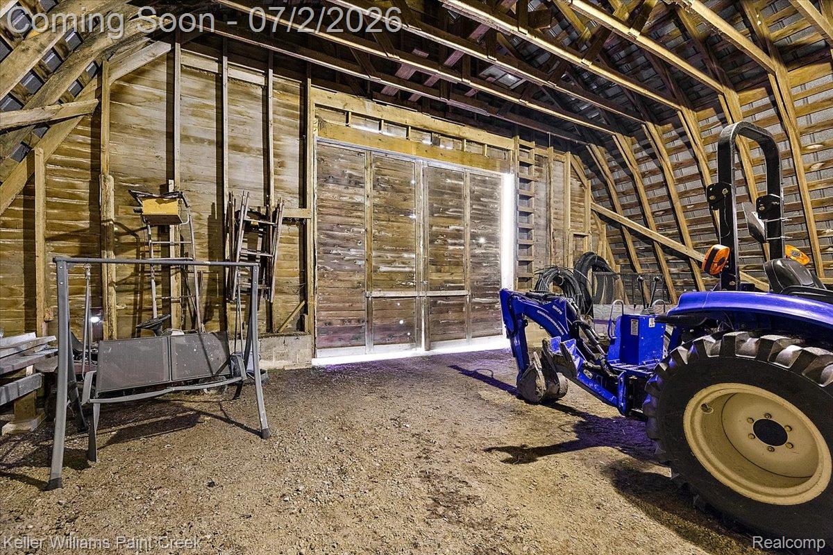54230 Card Road Macomb, MI 48042 - Photo 69 of 73 Barn interior featuring exposed timber framing and wooden plank walls