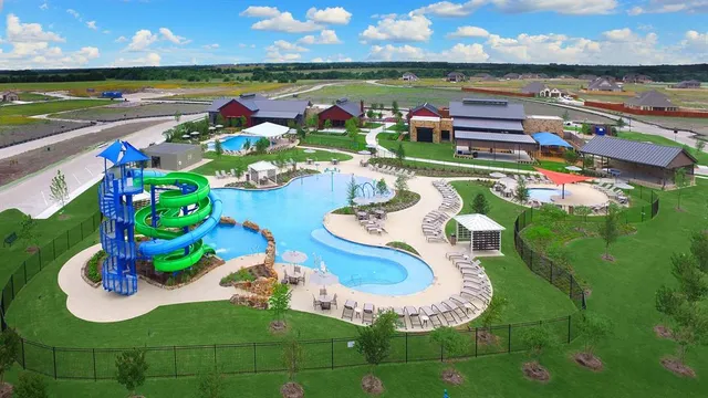 a swimming pool view with a garden