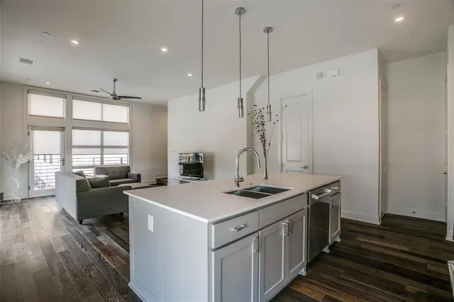 a kitchen that has a stove a sink and a refrigerator