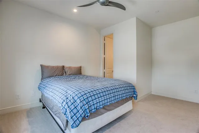 a bedroom with a bed and dresser