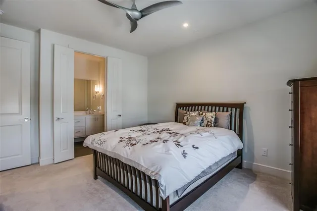 a bedroom with a bed and a table