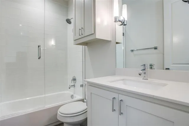 a bathroom with a sink a toilet and a bathtub