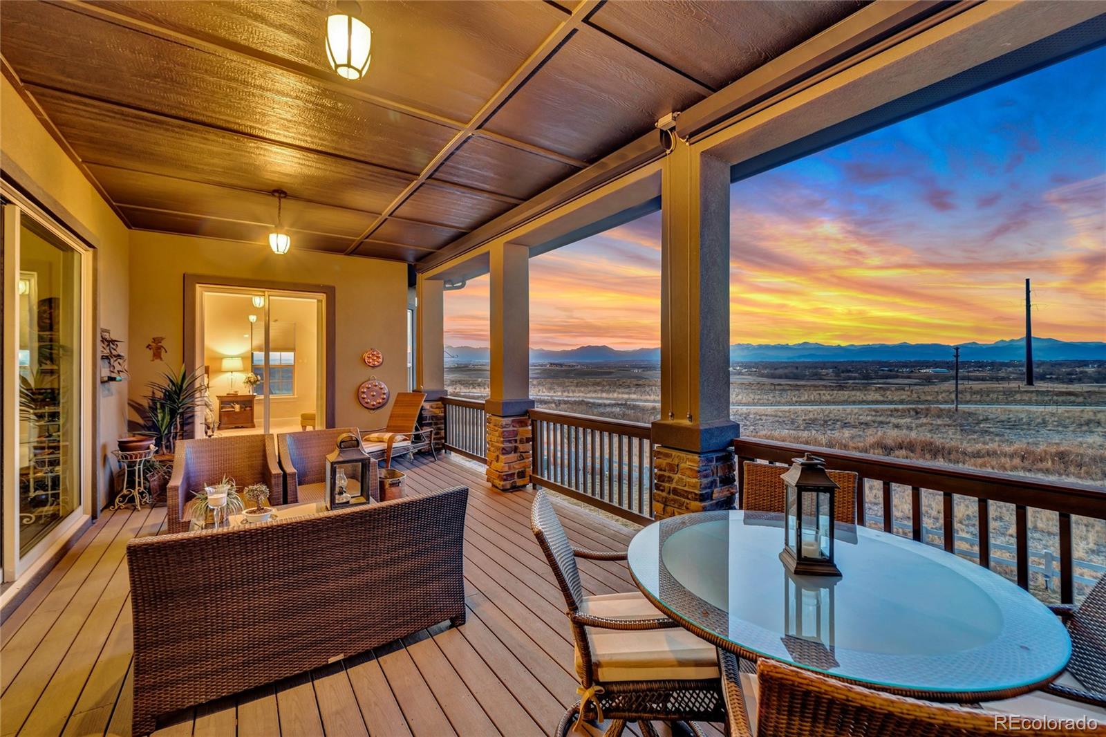15653 Deer Mountain Circle Broomfield, CO 80023 - Photo 11 of 37 a view of a balcony with chair and wooden floor