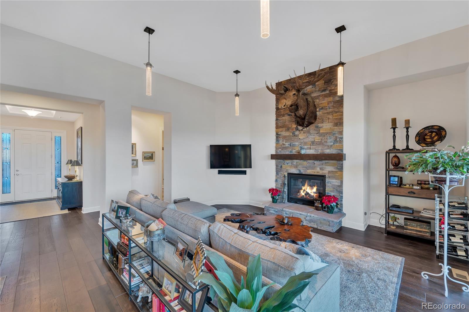 15653 Deer Mountain Circle Broomfield, CO 80023 - Photo 13 of 37 a living room with furniture and a fireplace
