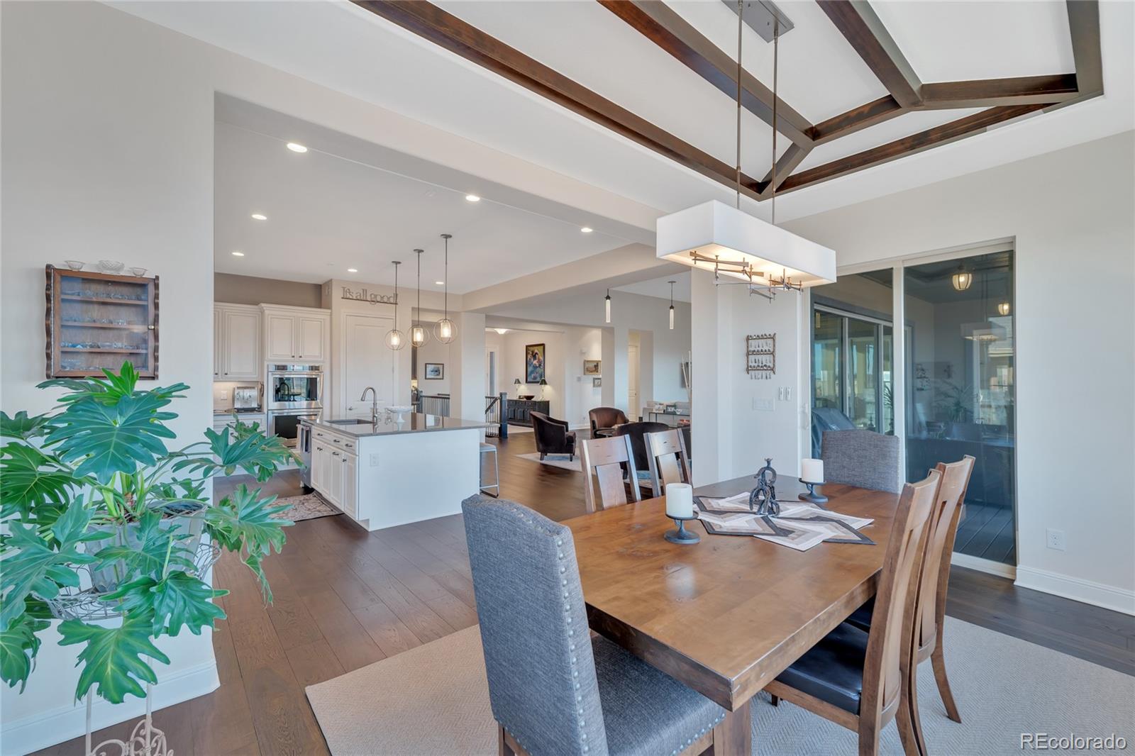 15653 Deer Mountain Circle Broomfield, CO 80023 - Photo 20 of 37 a view of a dining room with furniture and a chandelier
