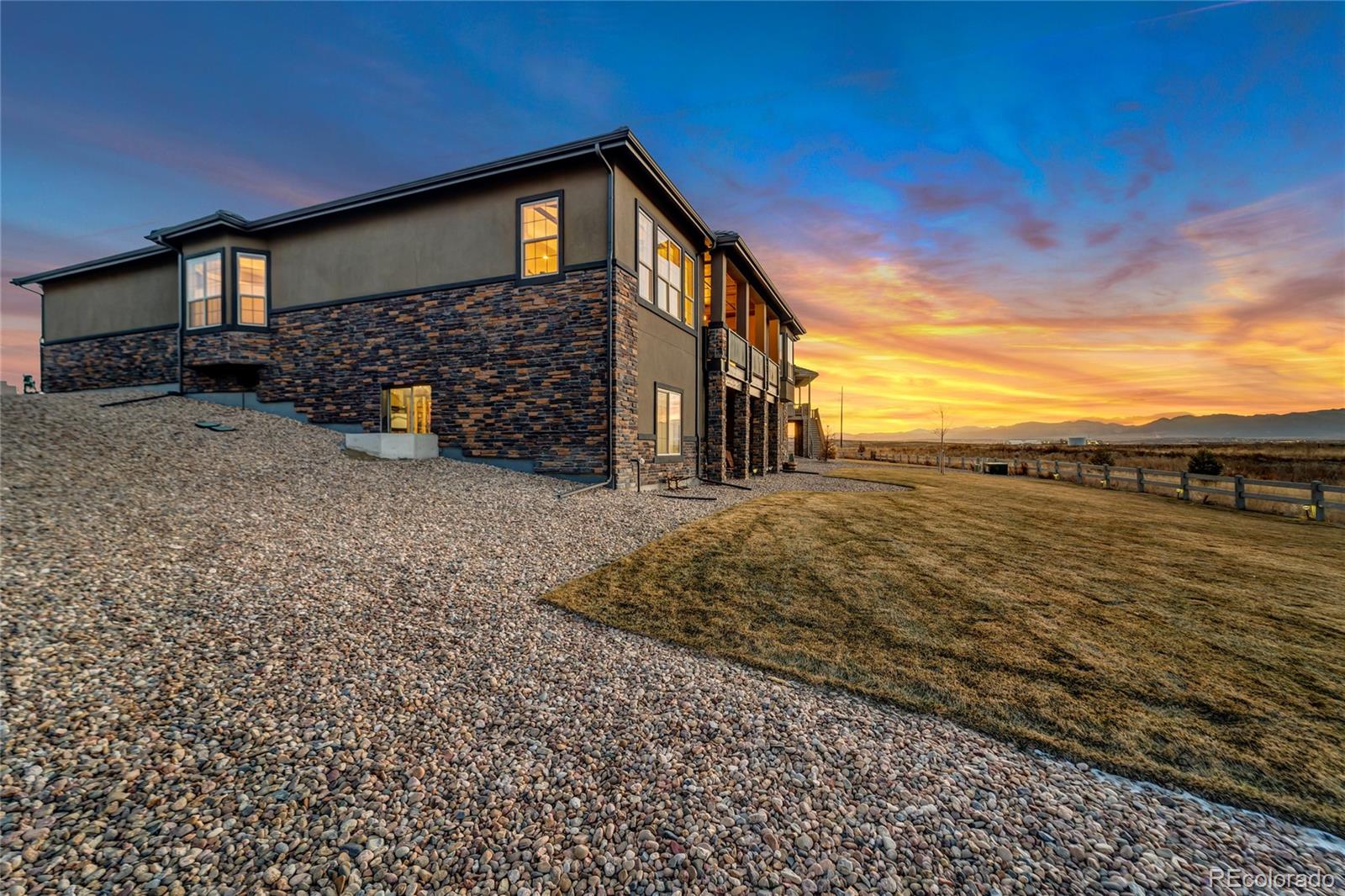 15653 Deer Mountain Circle Broomfield, CO 80023 - Photo 34 of 37 a view of a house with a yard