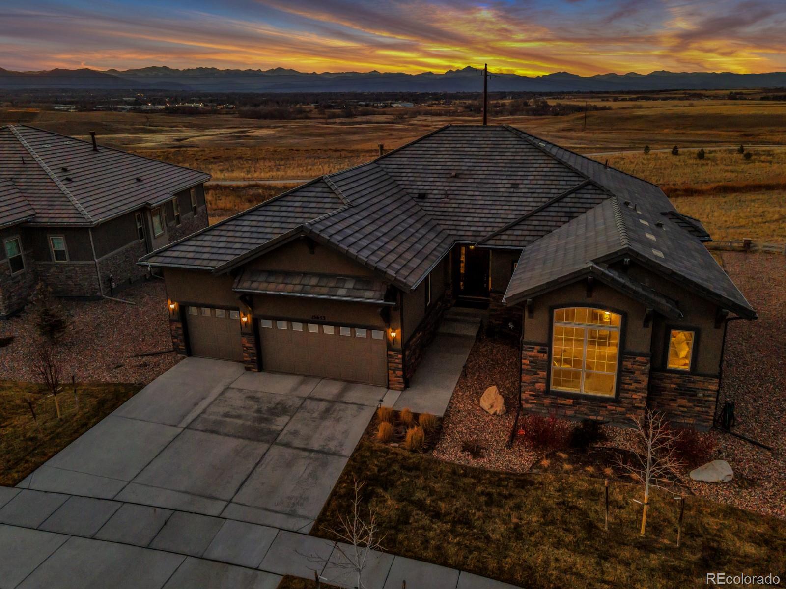 15653 Deer Mountain Circle Broomfield, CO 80023 - Photo 37 of 37 a view of a terrace with a lake