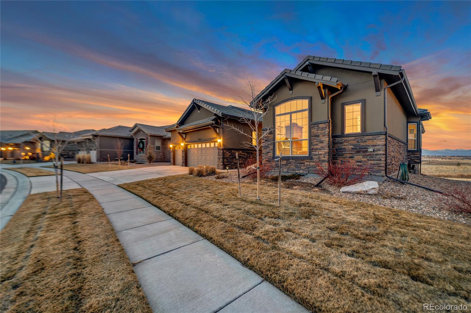 15653 Deer Mountain Circle Broomfield, CO 80023 - Photo 7 of 37 a front view of a house with garden