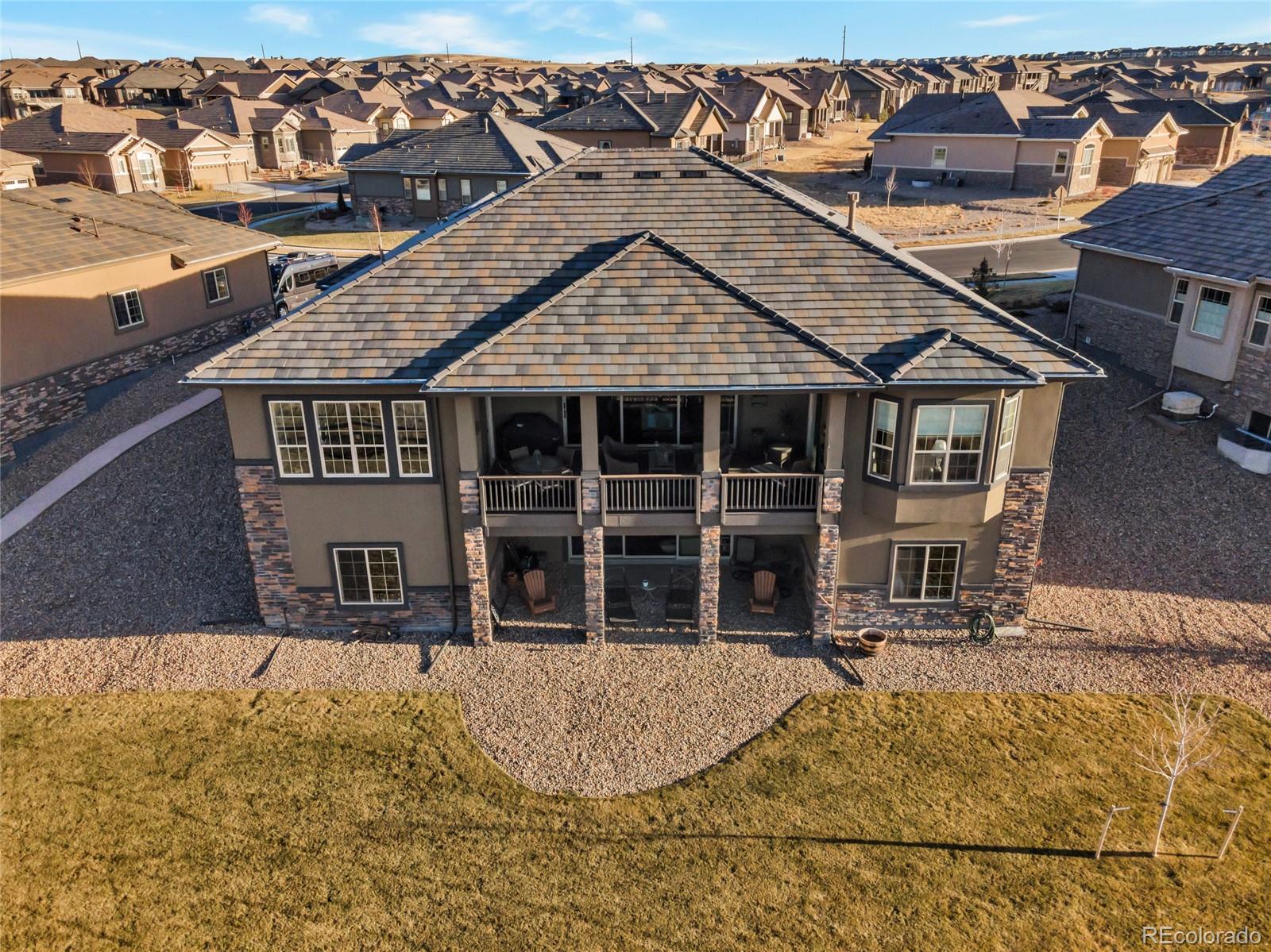 15653 Deer Mountain Circle Broomfield, CO 80023 - Photo 9 of 37 a view of a house with wooden fence