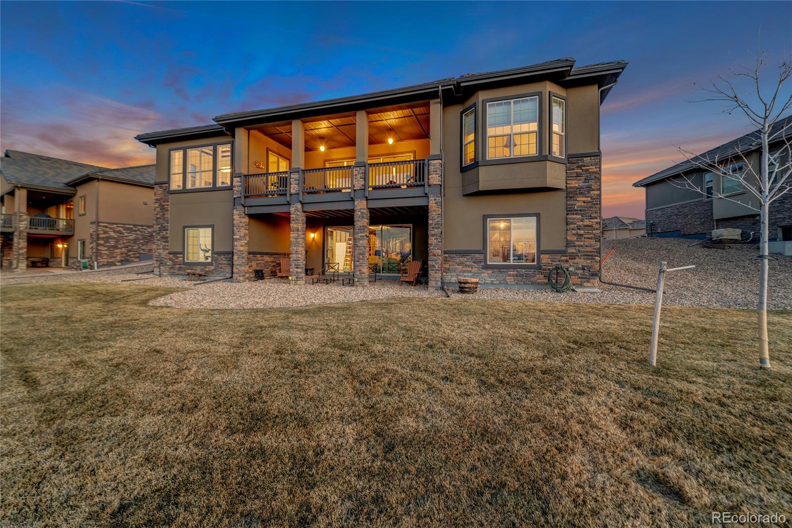 15653 Deer Mountain Circle Broomfield, CO 80023 - Photo 10 of 37 a front view of a house with a yard