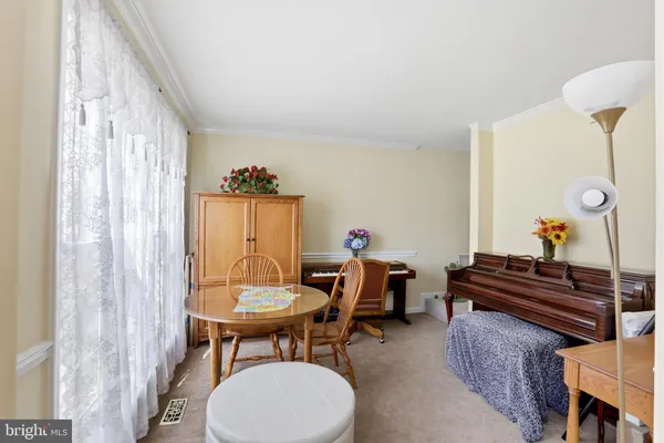 a view of a livingroom with furniture and a window