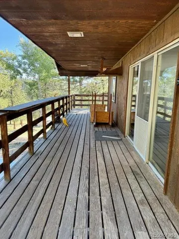 a view of balcony with wooden floor