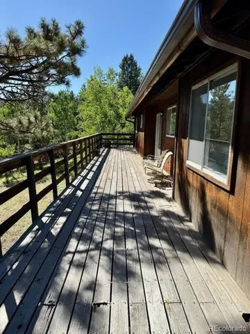 a view of balcony with wooden floor
