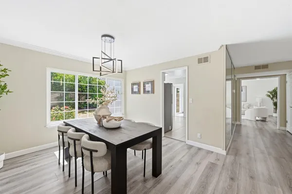 a kitchen with a refrigerator and a sink