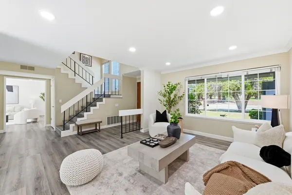 a living room with furniture and a table
