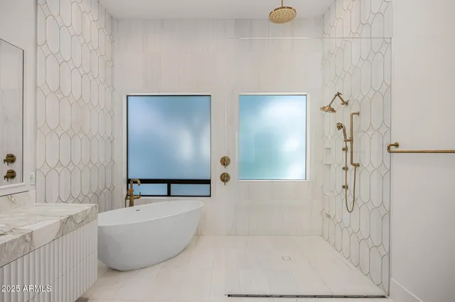 a bathroom with a tub and shower
