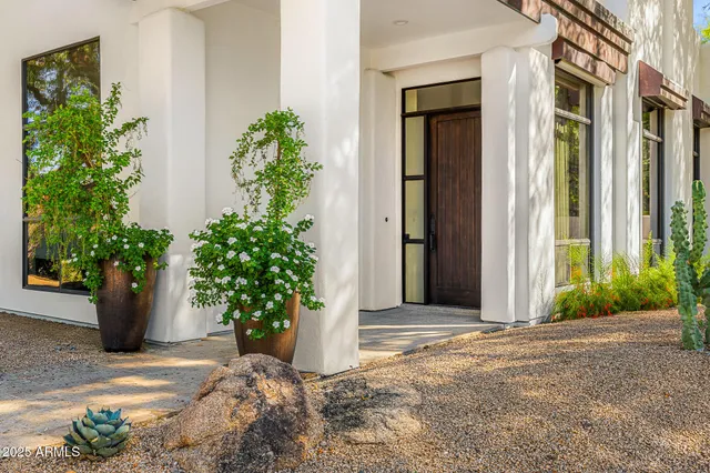 a view of a entryway with flower plants