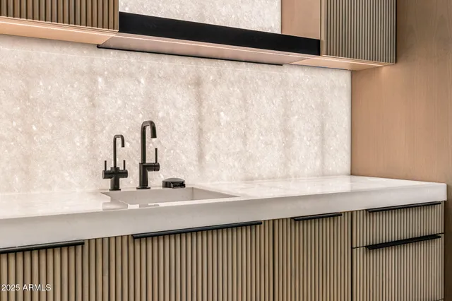 a kitchen with a sink and a window