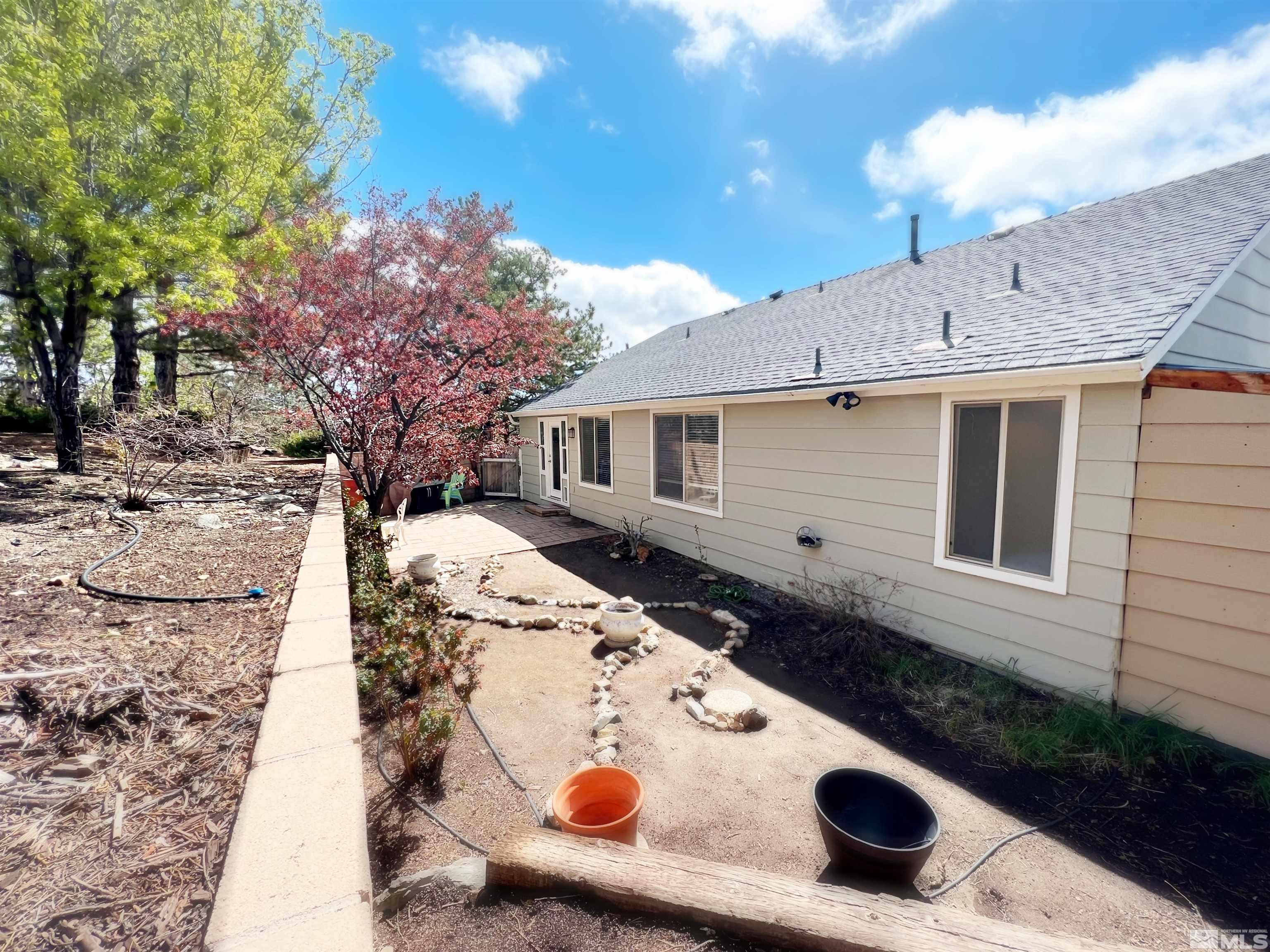 3849 Bexley Square Reno, NV 89503 - Photo 14 of 37 a view of house with backyard space and garden