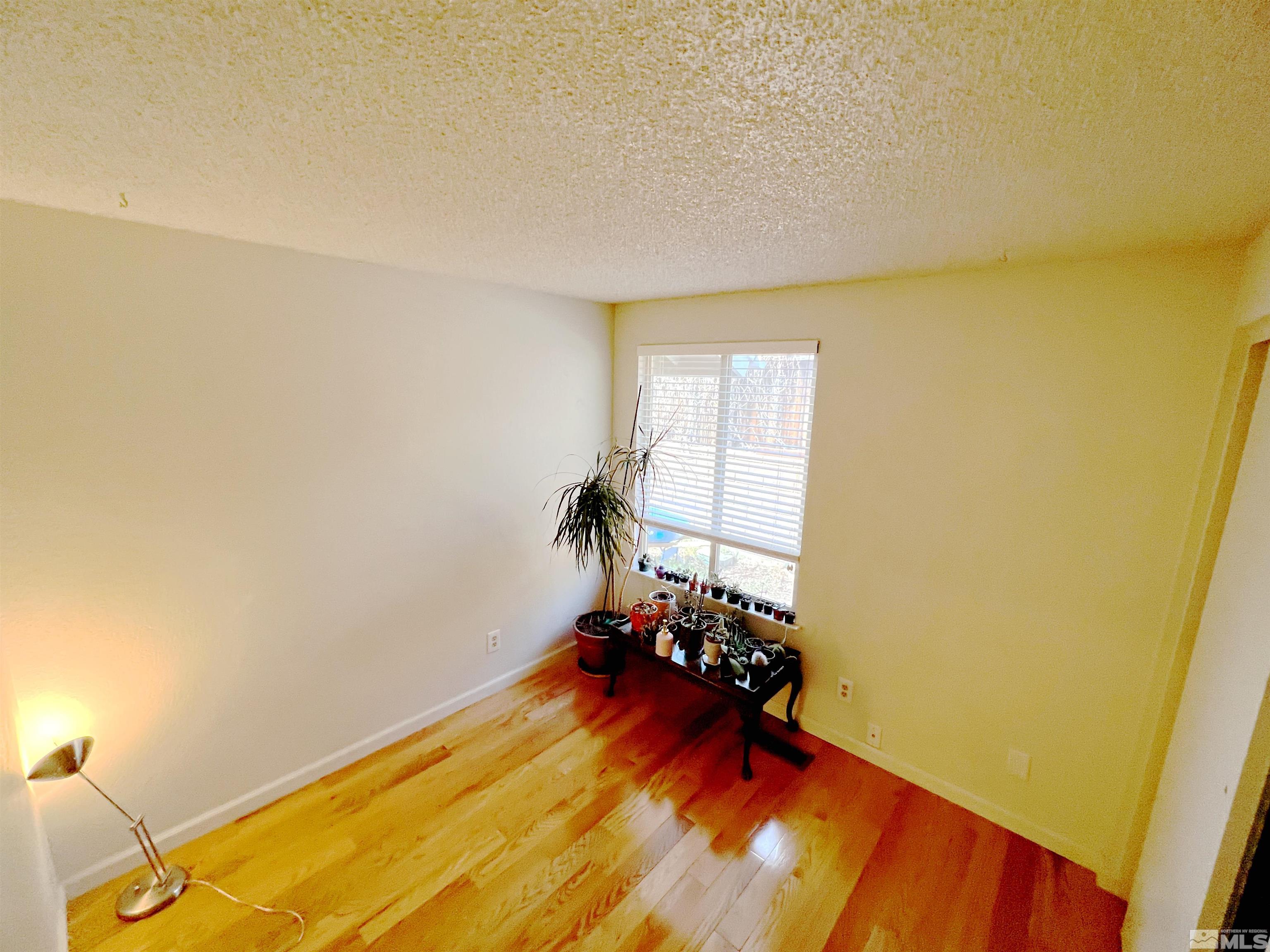 3849 Bexley Square Reno, NV 89503 - Photo 17 of 37 a view of a room with wooden floor