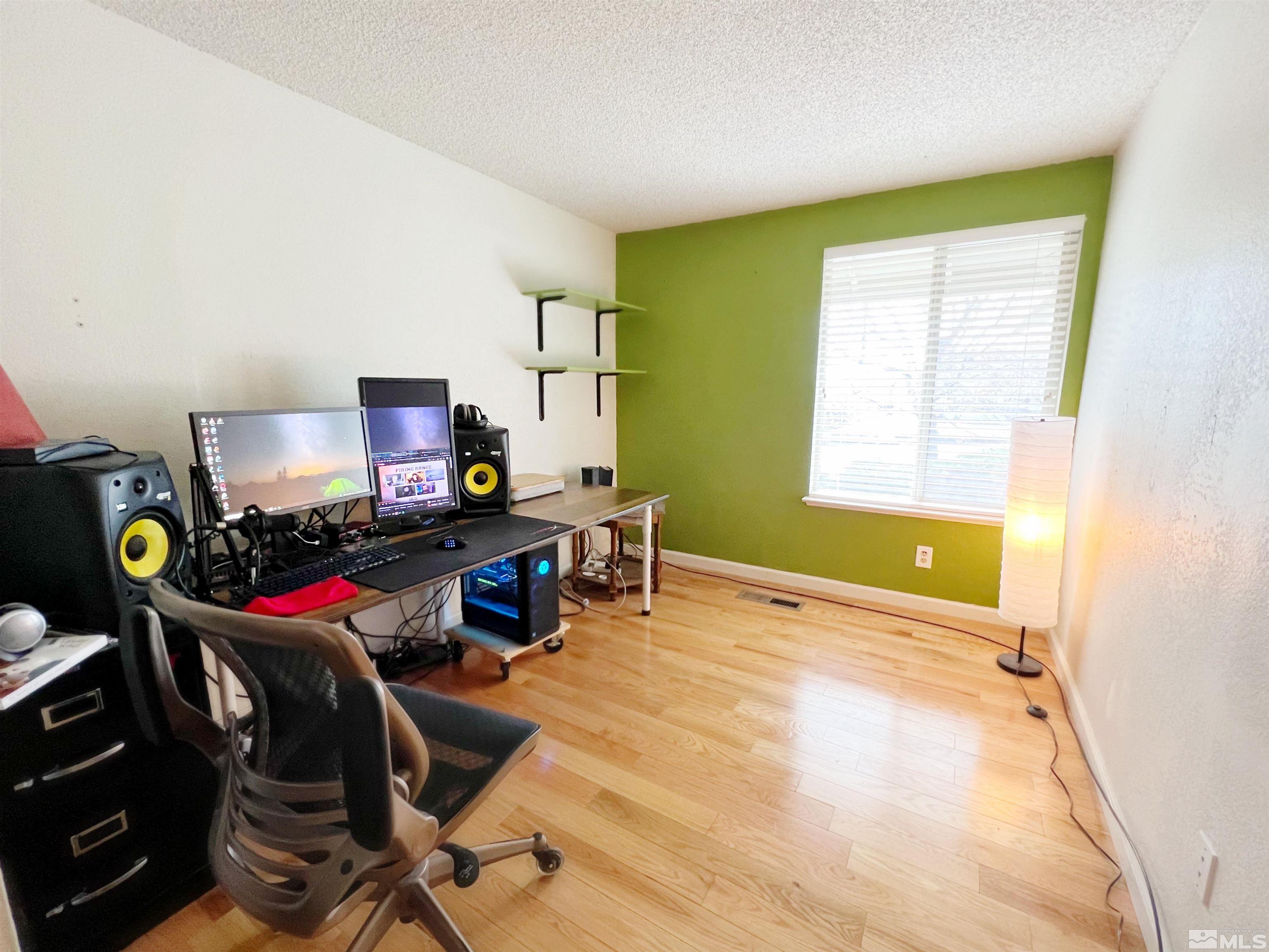 3849 Bexley Square Reno, NV 89503 - Photo 18 of 37 a view of a workspace with furniture and a window